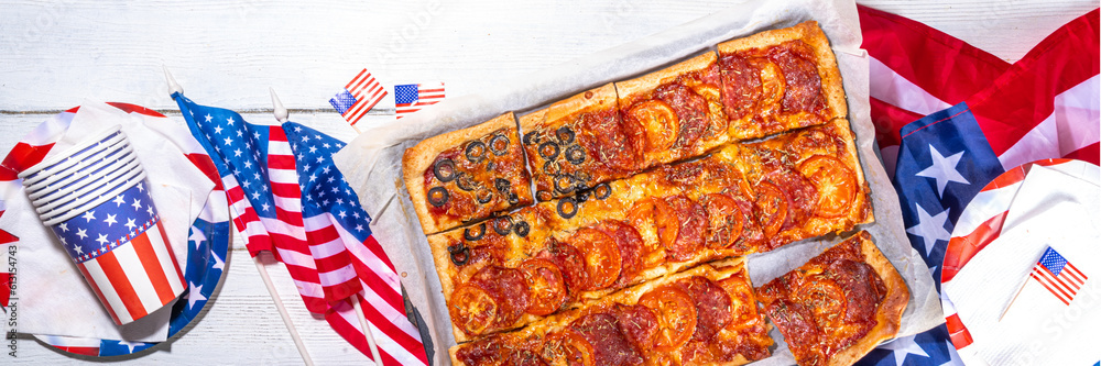 july 4th holiday party pizza, Fourth of July, Patriotic Independence day festive and picnic food. Pepperoni, tomato and black olive pizza with lot of mozzarella, in form of American flag