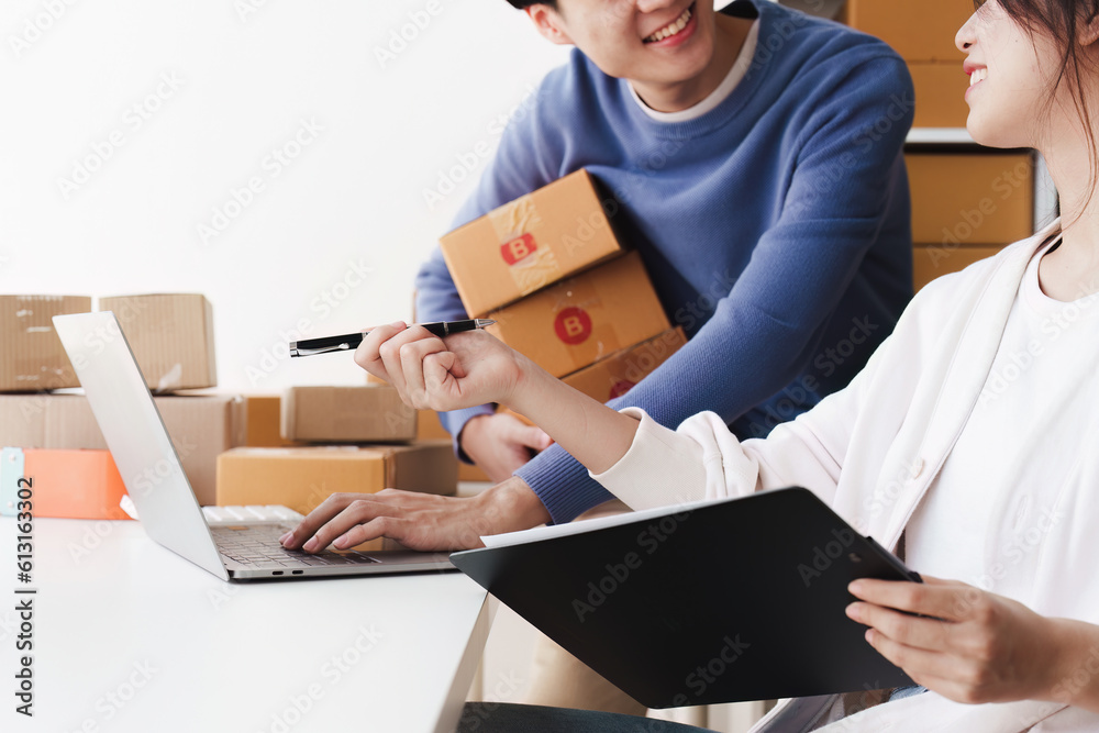 Small business owners couple entrepreneurs working with parcel, e-business, marketing, online shop, sme, entrepreneurs Small business owners couple entrepreneurs working with parcel, e-business, marketing, online shop, sme, entrepreneurs