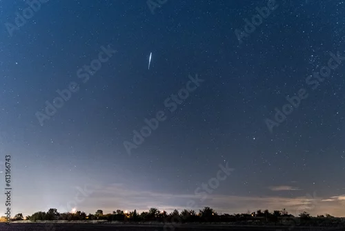 Obraz Spadający meteor na nocnym niebie
