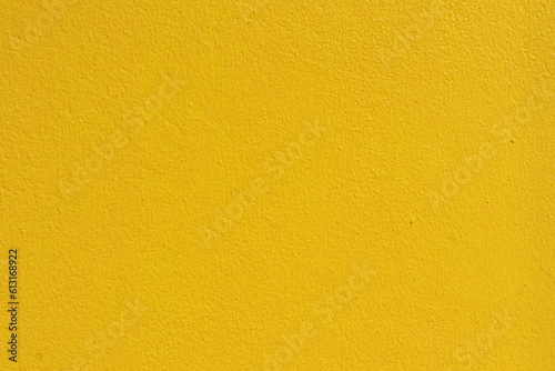 Empty yellow cement wall background and texture. Beautiful clean yellow concrete wall Advertising Backdrop. yellow wall.