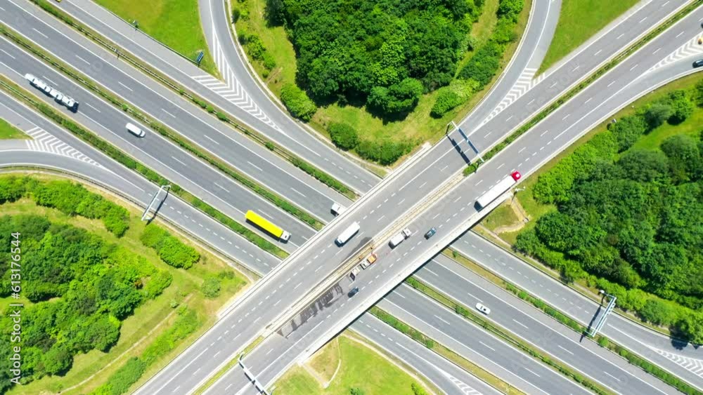 Crossroads in the green fields. Aerial view to highway with traffic. Concept of sustainable development and circular economy. Crossroads in the green fields. Aerial view to highway with traffic. Concept of sustainable development and circular economy.