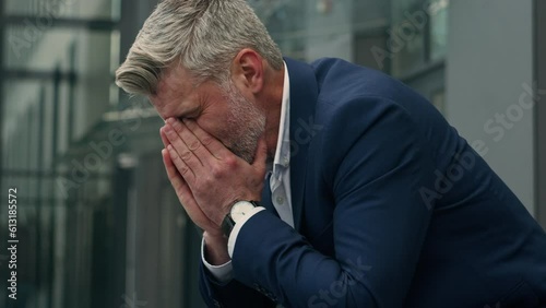 Caucasian sad upset business man senior mature stressed ill depressed businessman middle-aged gray haired hopeless despair employer in city suffering headache failure problem unemployment grief stress