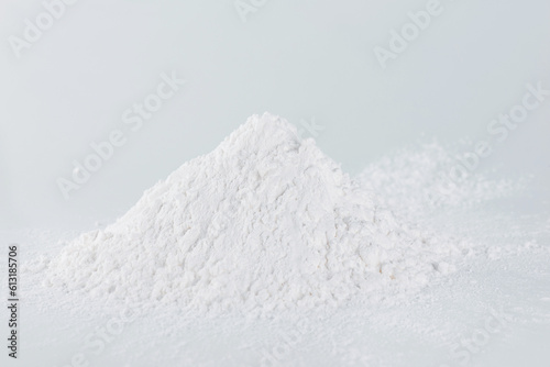 Pile of tapioca starch powder on a light background, selective focus.
