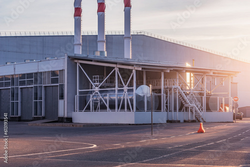 Exterior of the warehouse boiler room at sunset.