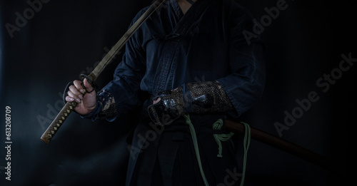 籠手を着けて日本刀を構える人物（Samurai with his katana and gauntlet） photo