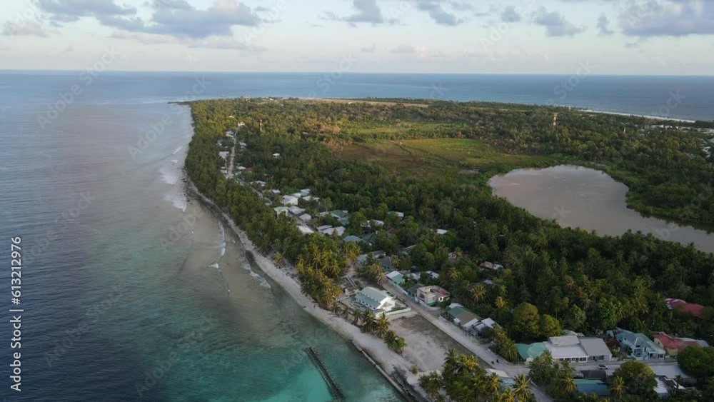 Aerial view of tropical beach landscape at Fuvahmulah island, a famous dive site for tiger sharks in South Maldives. Summer holiday and vacation travel concepts. 4K footage drone video Aerial view of tropical beach landscape at Fuvahmulah island, a famous dive site for tiger sharks in South Maldives. Summer holiday and vacation travel concepts. 4K footage drone video