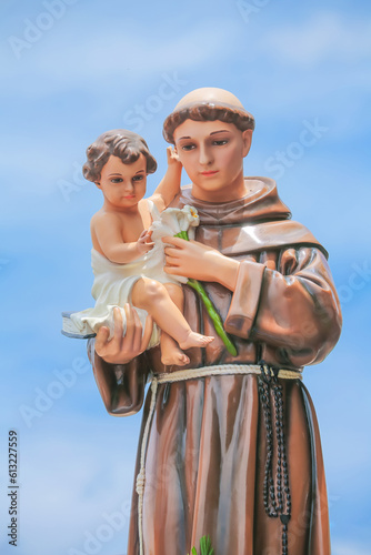 Saint Anthony holding child Jesus catholic religious statue photo