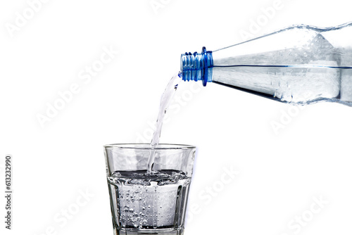 clean drinking glass and water from bottle isolated over transparent background