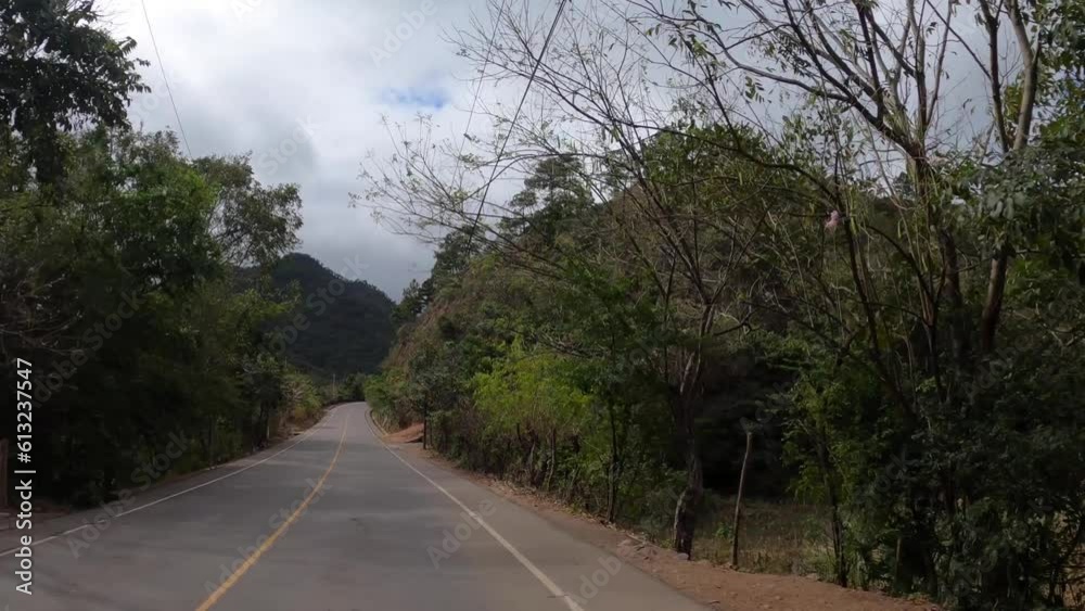 POV car driving along scenic road to Lago de Izabal, Guatemala POV car driving along scenic road to Lago de Izabal, Guatemala