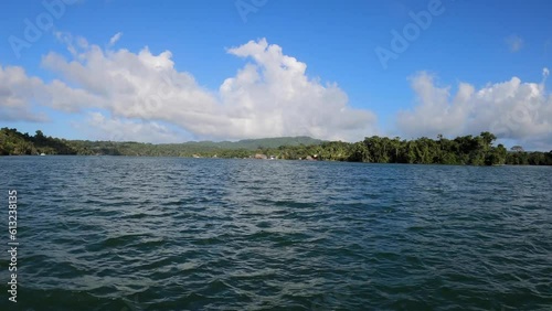 POV traveling by motorboat on El Golfete lake, Rio Dulce National Park, Guatemala photo