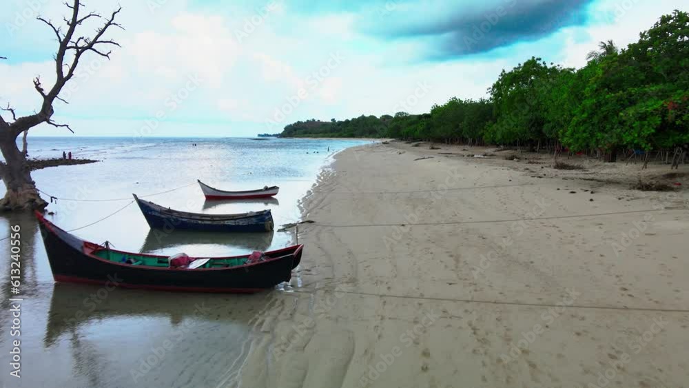 The shoreline area with a dark sky on the right and light one on the left The shoreline area with a dark sky on the right and light one on the left