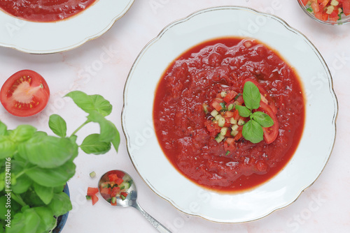 Plates with traditional gazpacho tomato soup