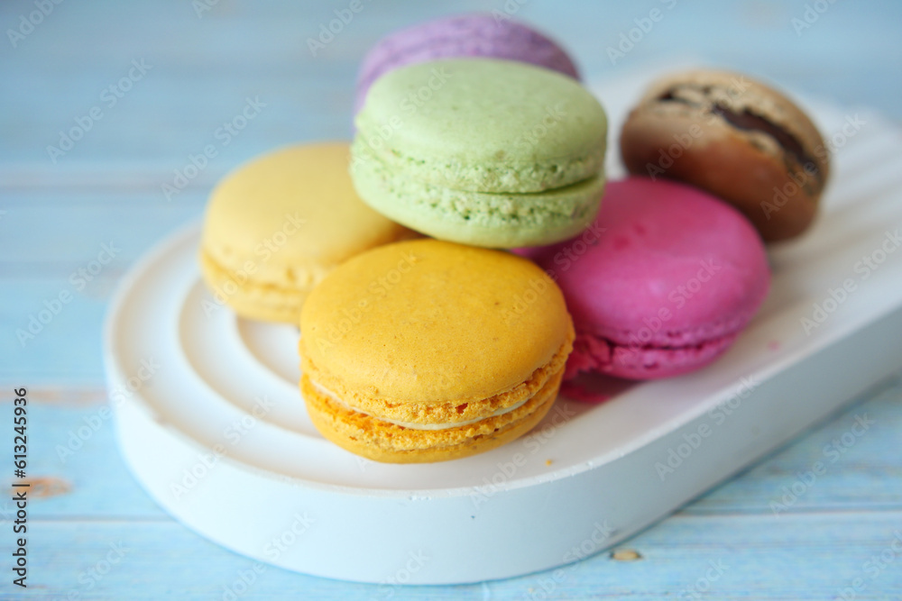 Close up of macaroon on blue background with copy space Close up of macaroon on blue background with copy space
