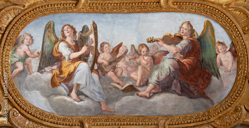 Valokuva GENOVA, ITALY - MARCH 5, 2023: The fresco of angels choir with the music instrumenst in the church Chiesa del Gesu by Giovanni Carlone from 17