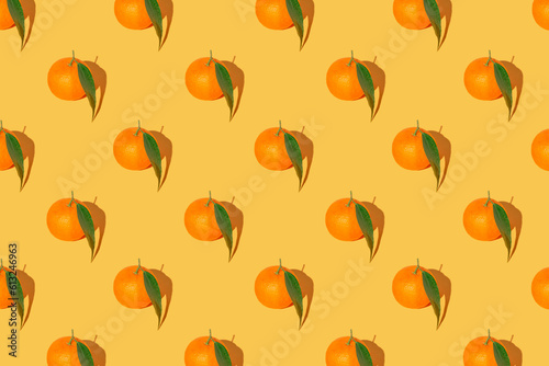 Wallpaper Mural Creative pattern made of fresh orange mandarin with green leaf on bright background. Summer refreshment and vitamin concept. Minimal style Torontodigital.ca