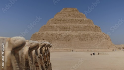 Djoser pyramid also called as Step Pyramid. Close up of ancient snakes.