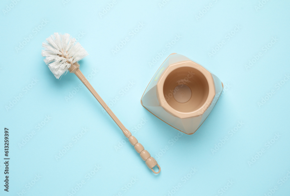 Toilet brush on blue pastel background. Top view Toilet brush on blue pastel background. Top view