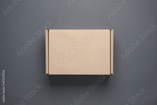 Parcel cardboard boxes on a dark background. Top view © splitov27