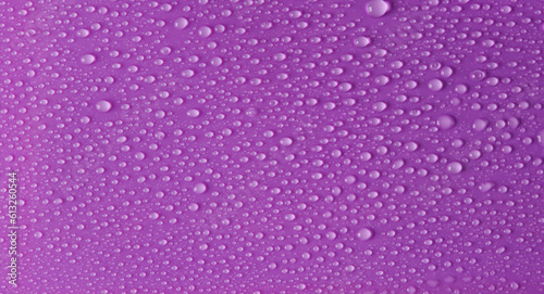 Water drops on purple background. Surface for design