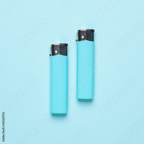 Lighters on a blue background. Minimalism.