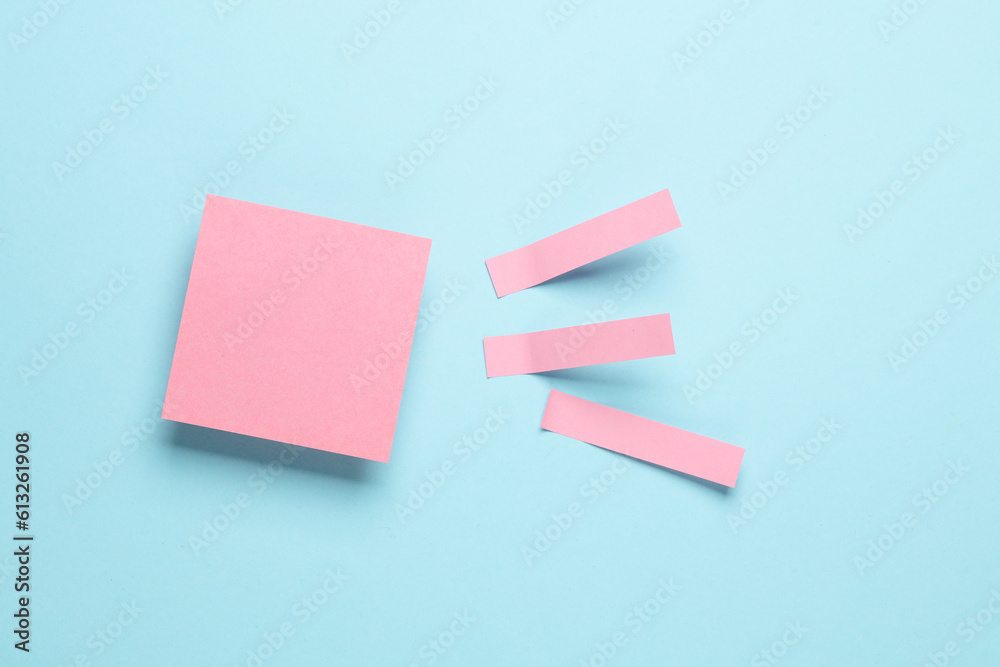 Pink blank note memo stickers on blue pastel background Pink blank note memo stickers on blue pastel background