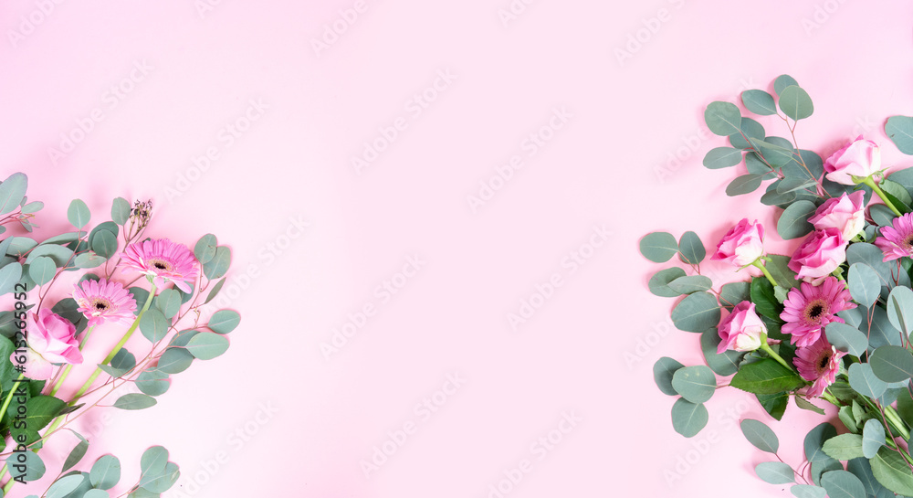 wedding or mothers day background, bouquet of roses and herberas with fresh eucaliptus leaves over plain pink background