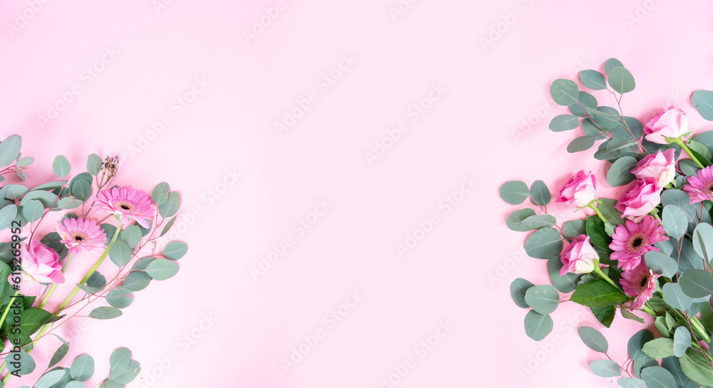 wedding or mothers day background, bouquet of roses and herberas with fresh eucaliptus leaves over plain pink background wedding or mothers day background, bouquet of roses and herberas with fresh eucaliptus leaves over plain pink background