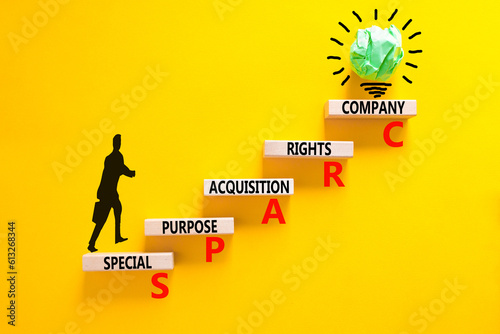 SPARC special purpose acquisition company symbol. Concept words SPARC special purpose acquisition company on wooden block. Yellow background. Business SPARC special purpose acquisition company concept photo