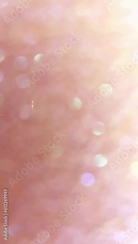 Glowing red pink bokeh background with floating light particles.