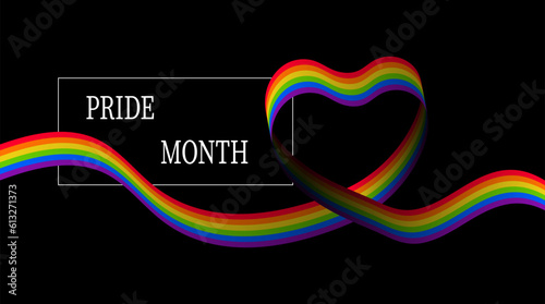 Heart shaped rainbow flag with pride month on black background.