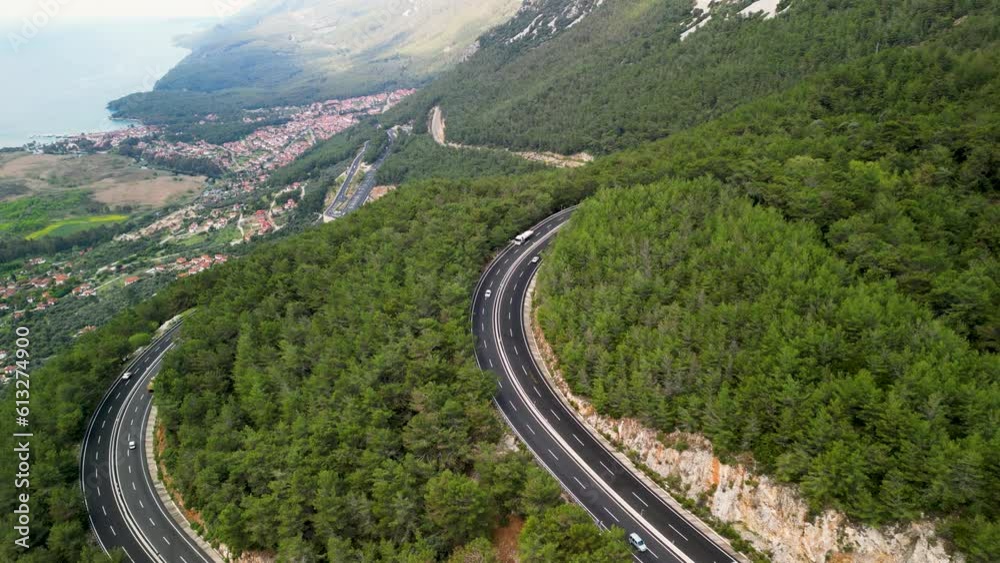 Urban Landscape from Above: Bridge, Expressway, and Lush Tree-Lined Overpass. A viewpoint from on high capturing the urban scenery featuring a bridge, expressway traffic, and the verdant tree-lined ov Urban Landscape from Above: Bridge, Expressway, and Lush Tree-Lined Overpass. A viewpoint from on high capturing the urban scenery featuring a bridge, expressway traffic, and the verdant tree-lined ov