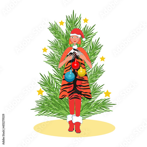 Christmas tree and a girl holding Christmas balls.