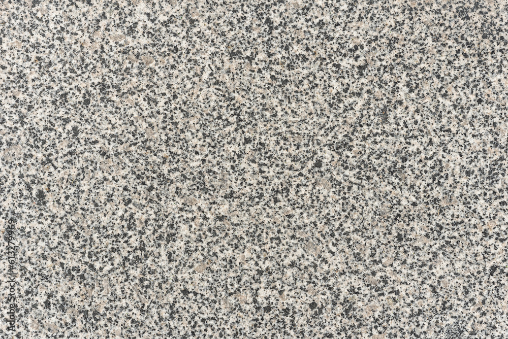 Natural gray granite with black spots, background. Natural gray granite with black spots, background.