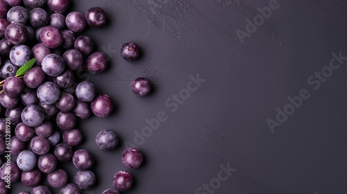 Açaí berries, isolated on slate tone background with copyspace, Generative AI.