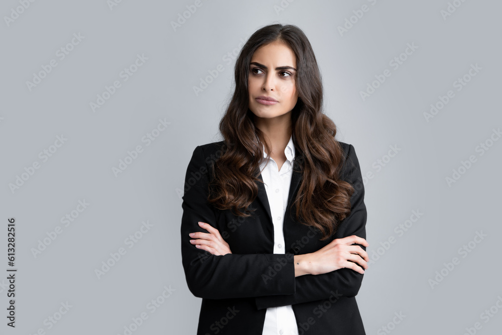 Portrait of young woman thinking, looking up empty space. Thoughtful serious model in studio looking away. Female student, young teacher.