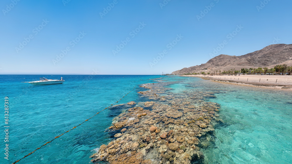 Underwater corals along empty beach on popular resort of Eilat on Red Sea in Israel.