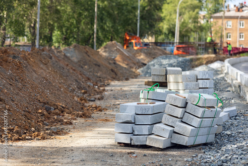 Pile of concrete paving slabs on a construction site. Road construction