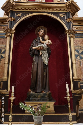 Aracena, Huelva, Spain, June 12, 2023: Saint Anthony with the baby Jesus in the Church of Nuestra Señora del Carmen. Building of the 16th, 17th century. Aracena, Huelva, Spain