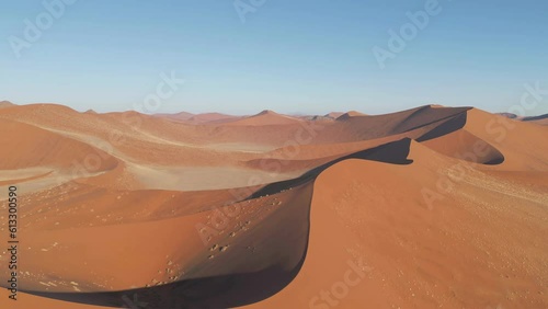 Aerial top view of Namib Desert Safari with sand dune in Namibia, South Africa. Natural landscape background at sunset. Famous tourist attraction. Sand in Grand Canyon photo