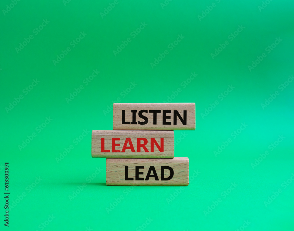 Listen Learn Lead symbol. Concept words Listen Learn Lead on wooden blocks. Beautiful green background. Business and Listen Learn Lead concept. Copy space.