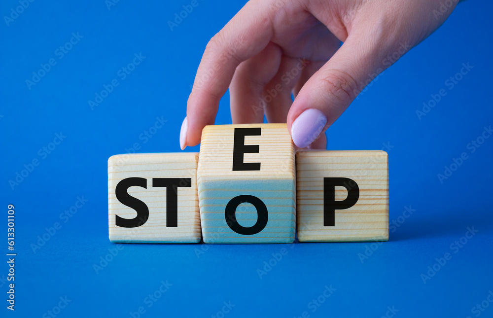 Step Vs Stop Symbol Businessman Hand Turns Wooden Cubes And Changes step-vs-stop-symbol-businessman-hand-turns-wooden-cubes-and-changes