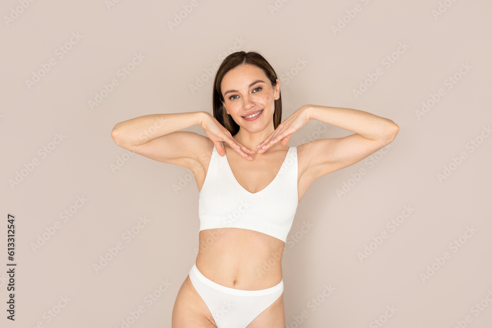 Beautiful smiling young woman showing her beautiful face