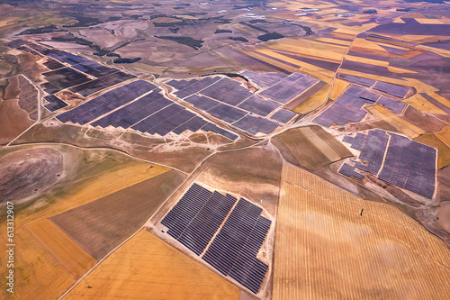 Solar Symphony: Aerial Marvel of a Massive Solar Park, Where Countless Panels Harness Clean Energy for a Brighter Future. Belinchon, Cuenca, Castilla La Mancha, Spain photo