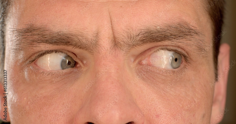 Fototapeta premium Eye training, a man makes a movement to the left, to the right to increase the tone of the organ of vision. Load on the internal organs, shifting the focus of attention.