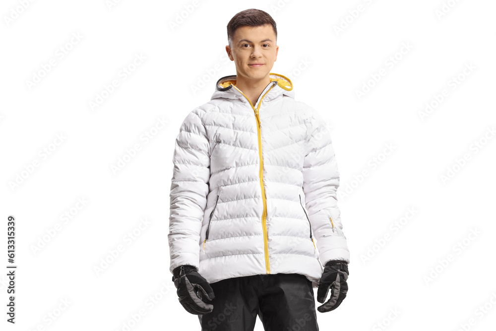 Fototapeta premium Guy in a white winter jacket and skiing pants