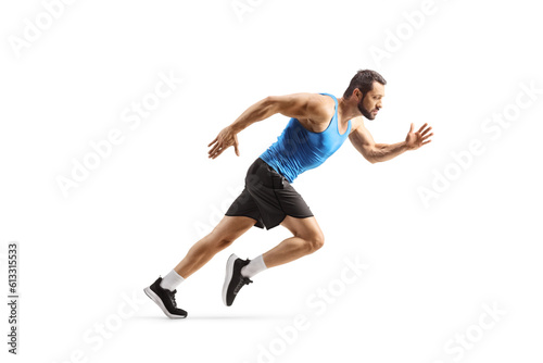 Fototapeta Naklejka Na Ścianę i Meble -  Full length profile shot of a fit man starting a run