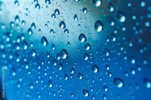 Water drops condensed on a glass window  rainy weather  raindrops  bluish background. Generative AI