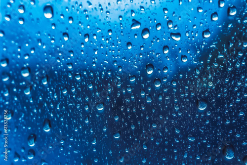 Water drops condensed on a glass window  rainy weather  raindrops  bluish background. Generative AI