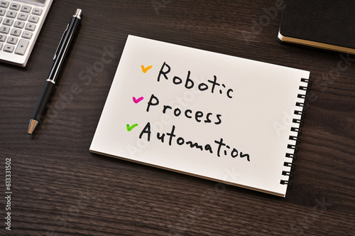 There is notebook with the word Robotic Process Automation. It is as an eye-catching image.