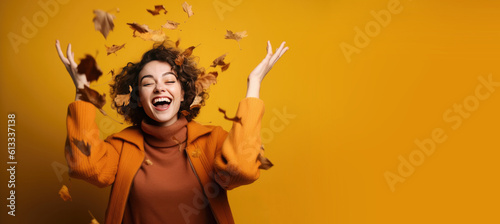 Woman in Fall Clothes Throwing Autumn Leaves in the Air Banner with Space for Copy